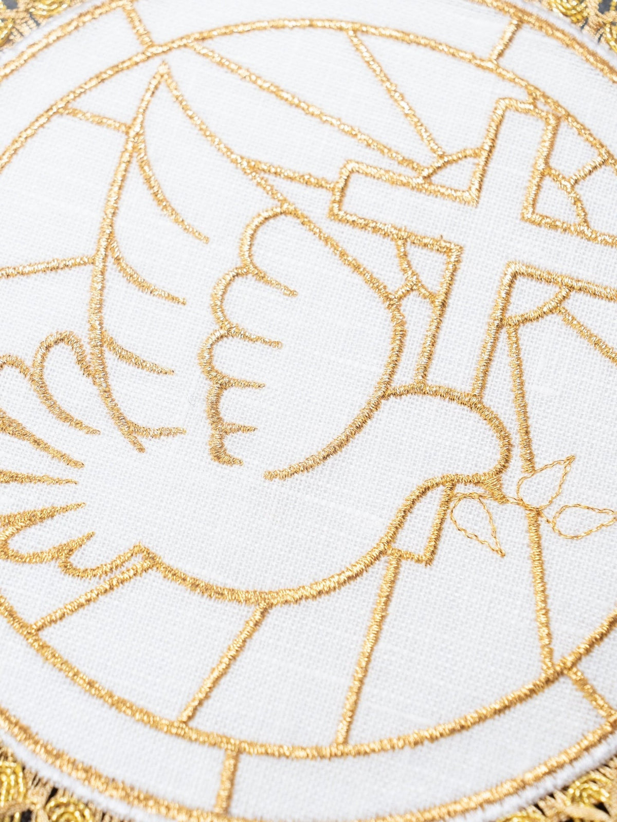 Chalice pall close-up with gold embroidered Holy Spirit dove and cross motif