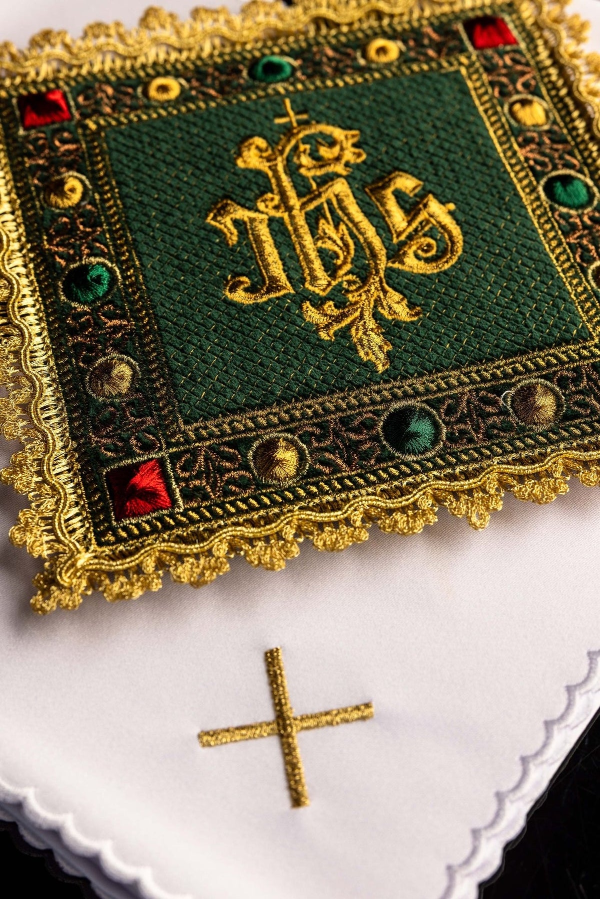 Green velvet altar linen set close-up showing embroidered gold IHS symbol and ornate trim