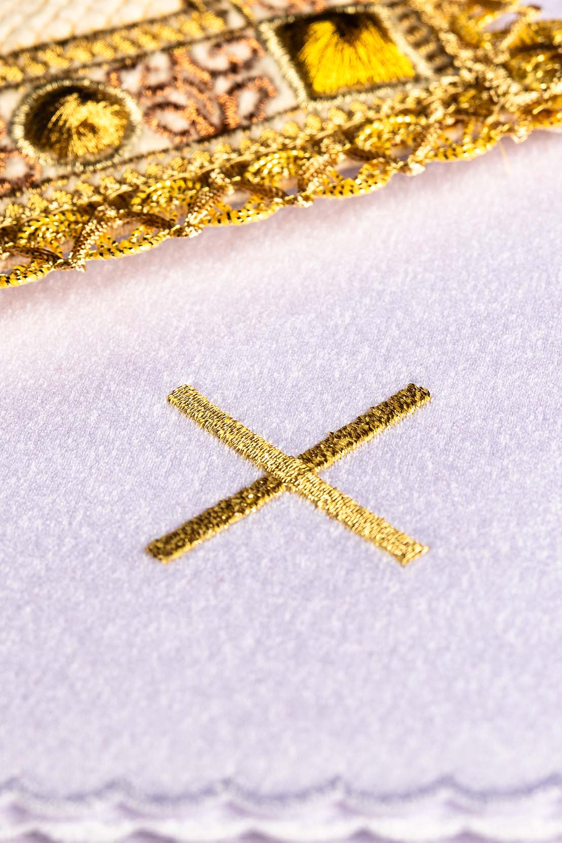 Altar linen set close-up of gold embroidered cross on ecru linen