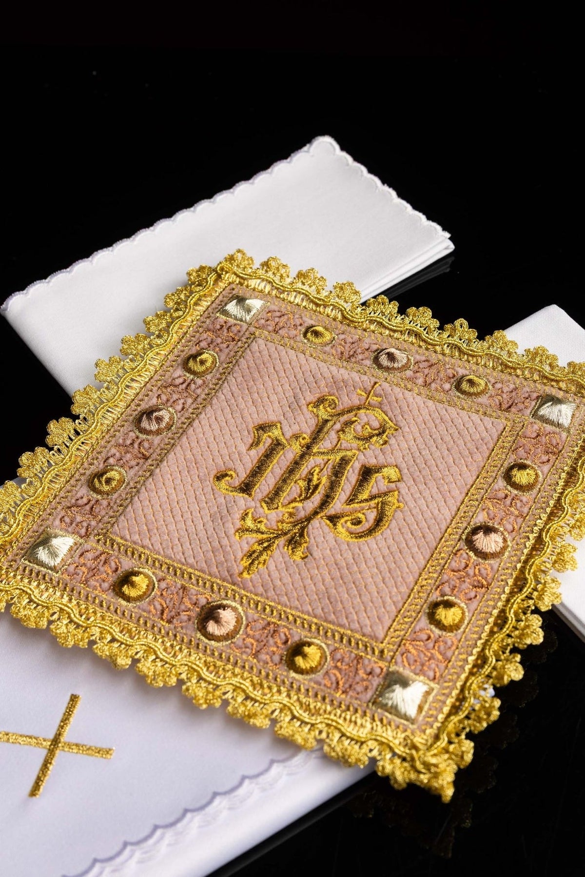 Rose velvet altar linen set close-up showing embroidered IHS symbol and ornate gold trim