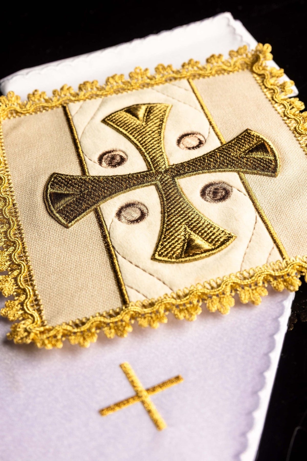 Altar linen set detail with ecru panel, gold cross embroidery and decorative border