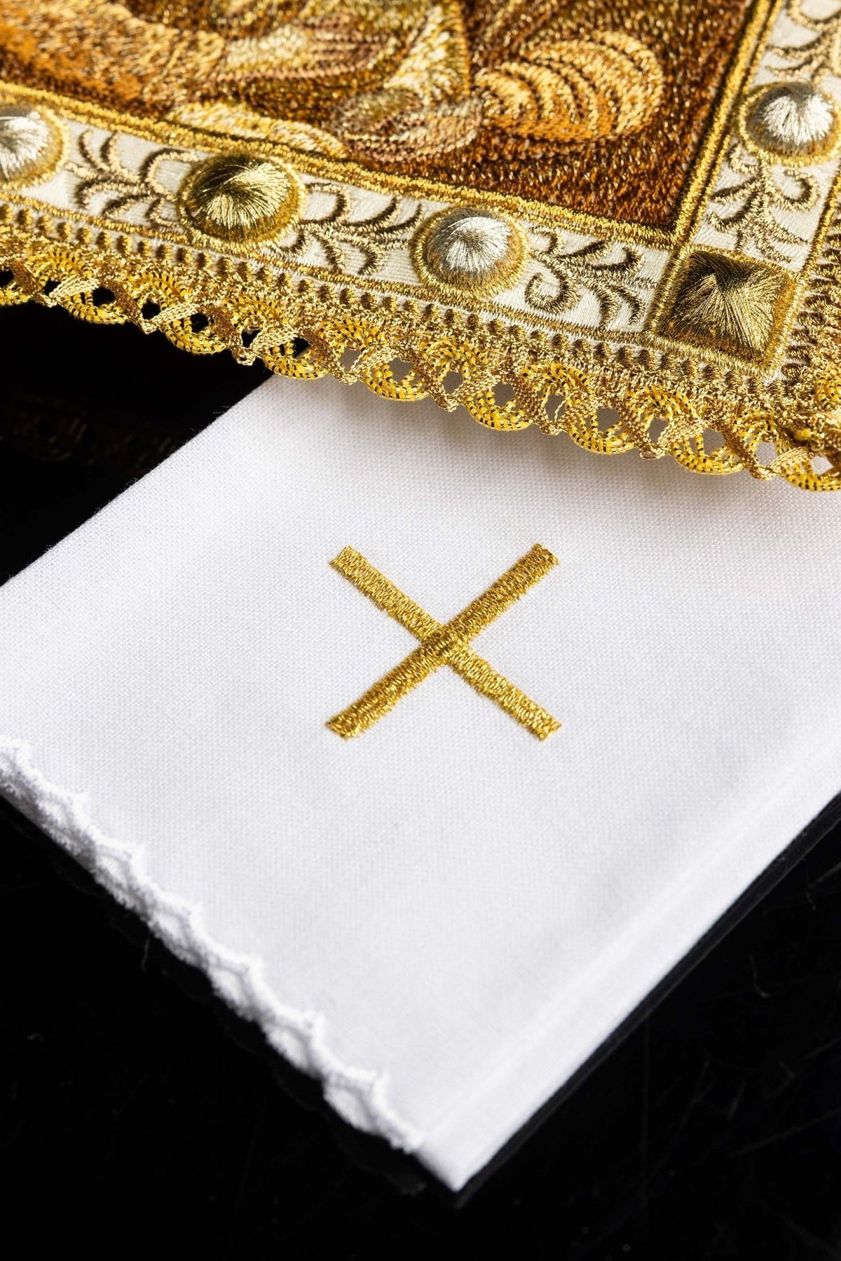 Altar linen set detail showing gold embroidery, floral border and scalloped trim