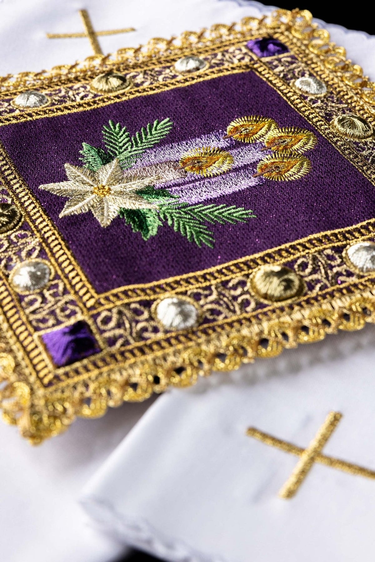 Advent altar linen set close-up showing embroidered purple candles, green branches and white star