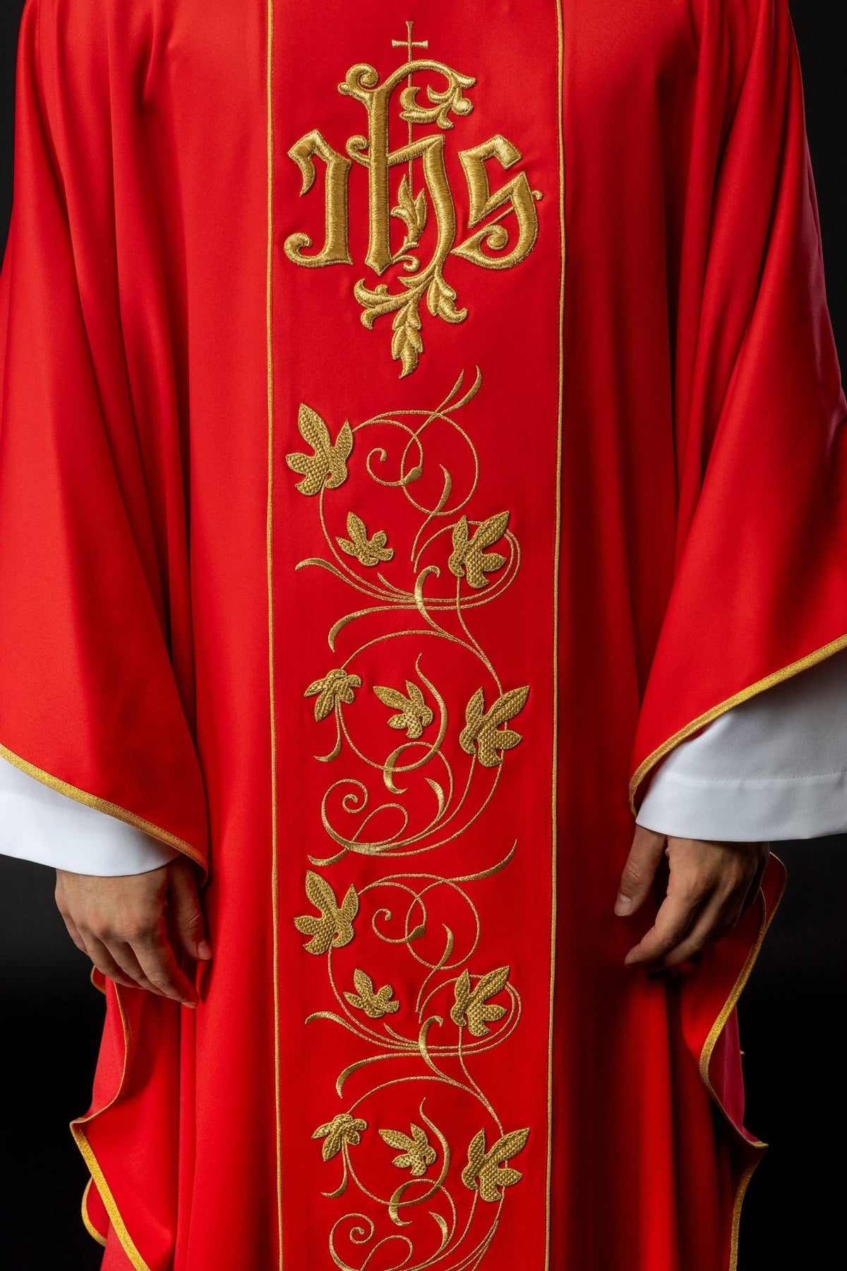 Red chasuble close-up of floral gold embroidery on the front orphrey