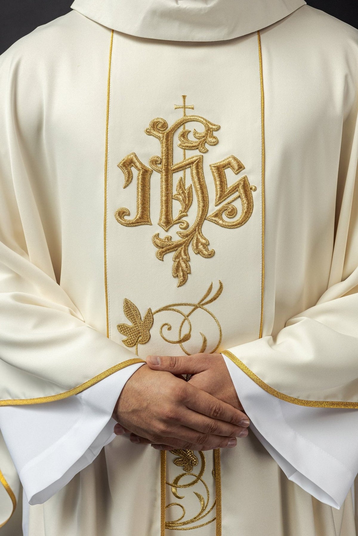 Ecru chasuble front detail with stand-up collar, gold IHS and floral embroidery