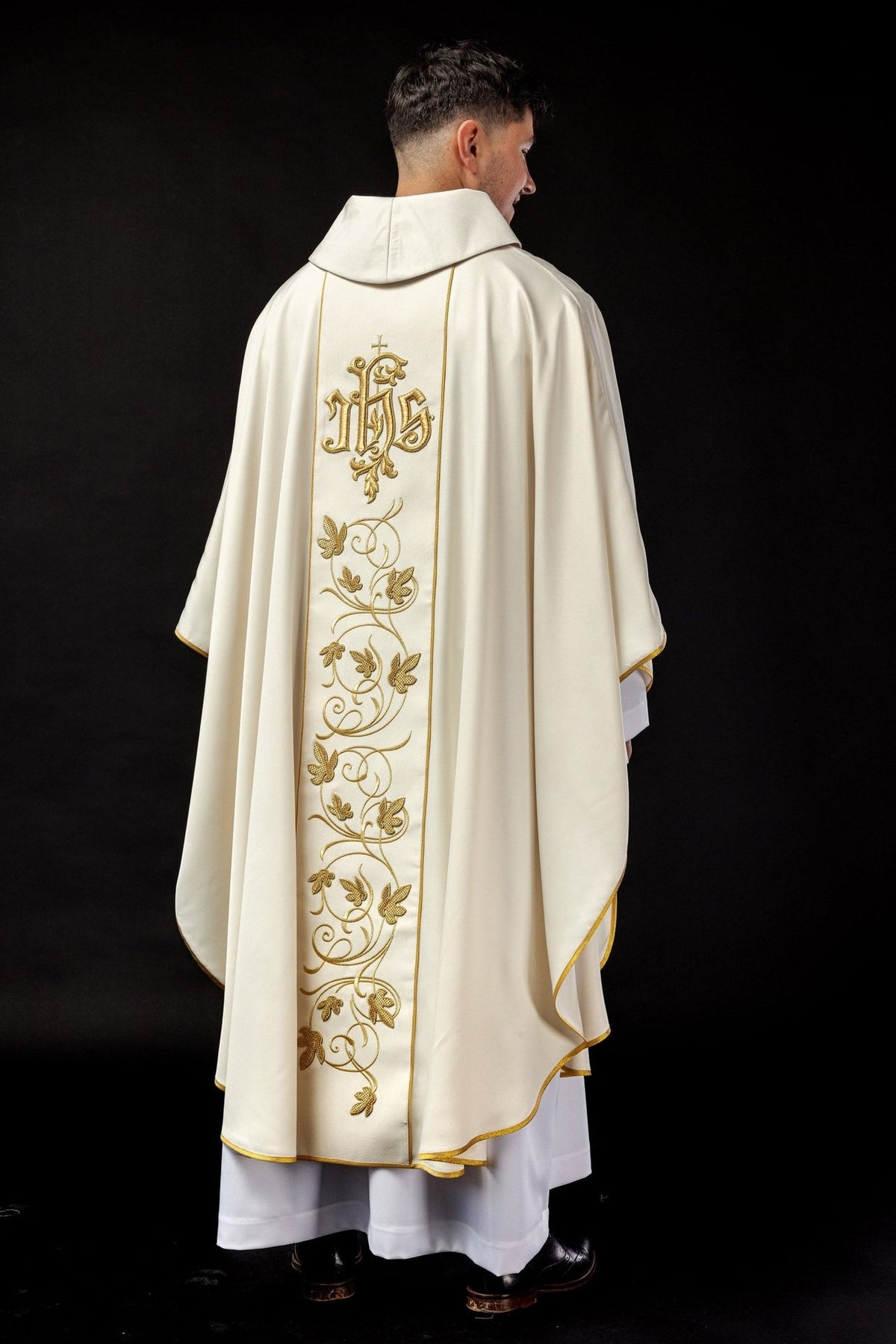 Ecru chasuble side-back view showing stand-up collar and gold orphrey