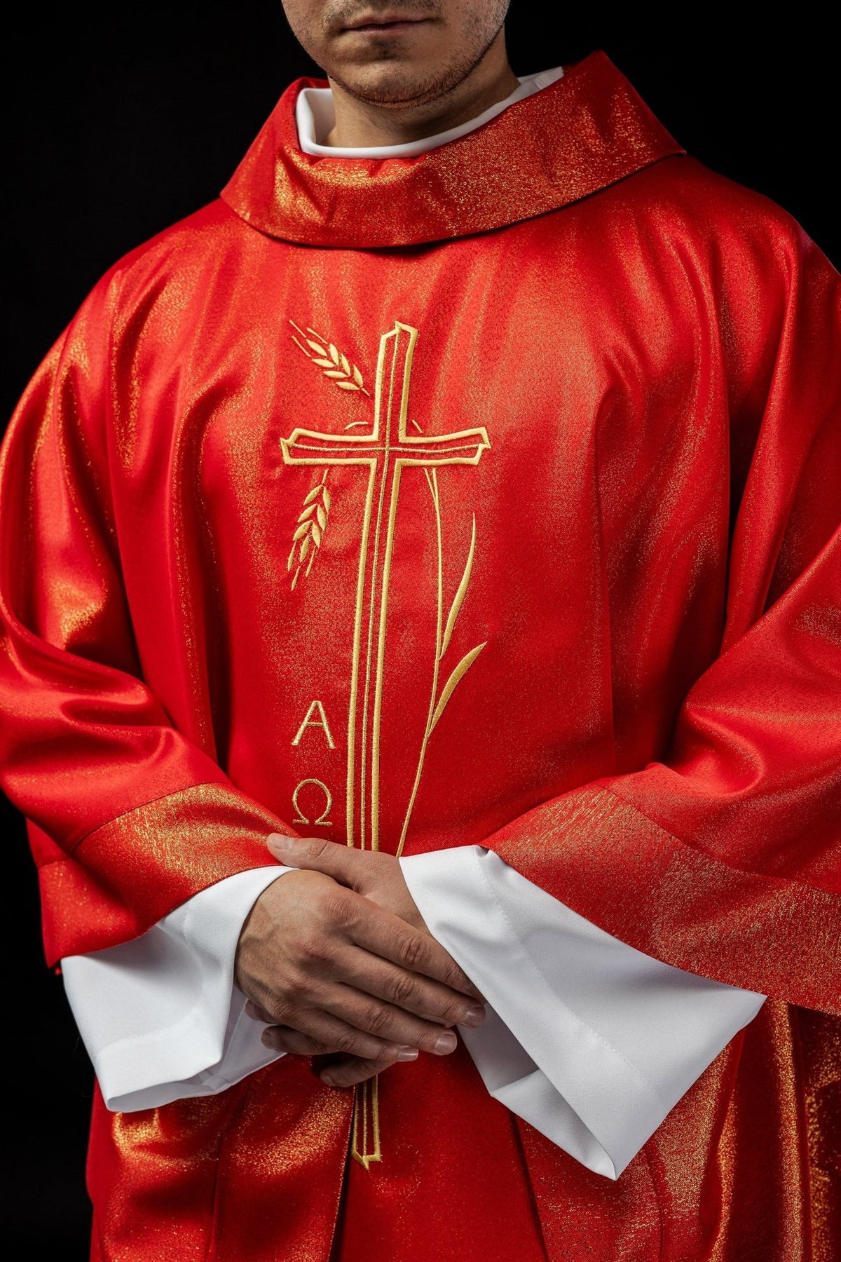 Red chasuble, front worn view with gold cross and wheat motif