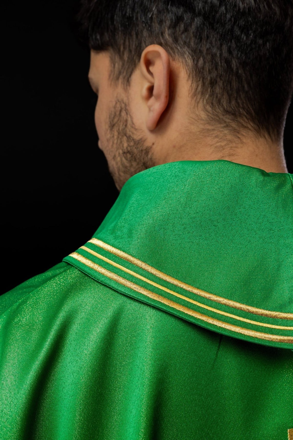 Green chasuble close-up of gold embroidered trim at the collar
