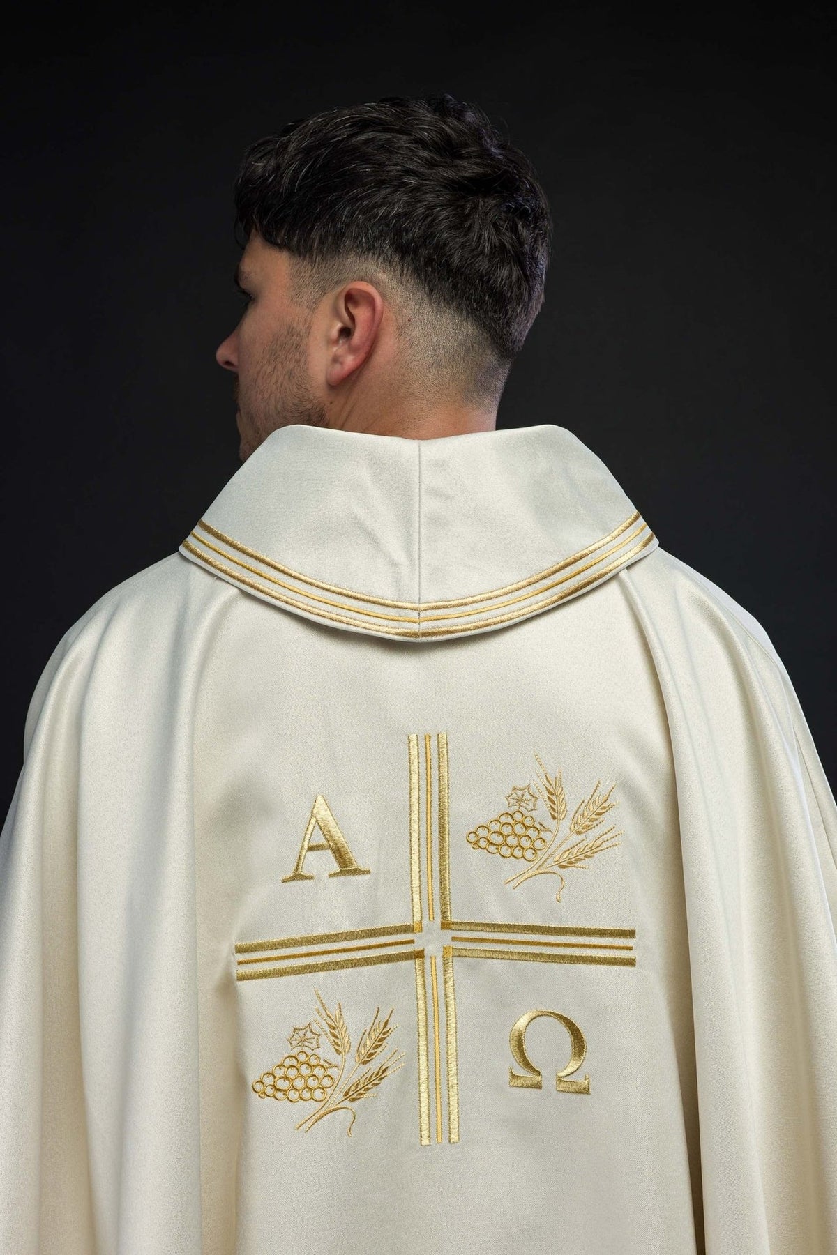Ecru chasuble back view with embroidered cross, Alpha Omega, and wheat motifs