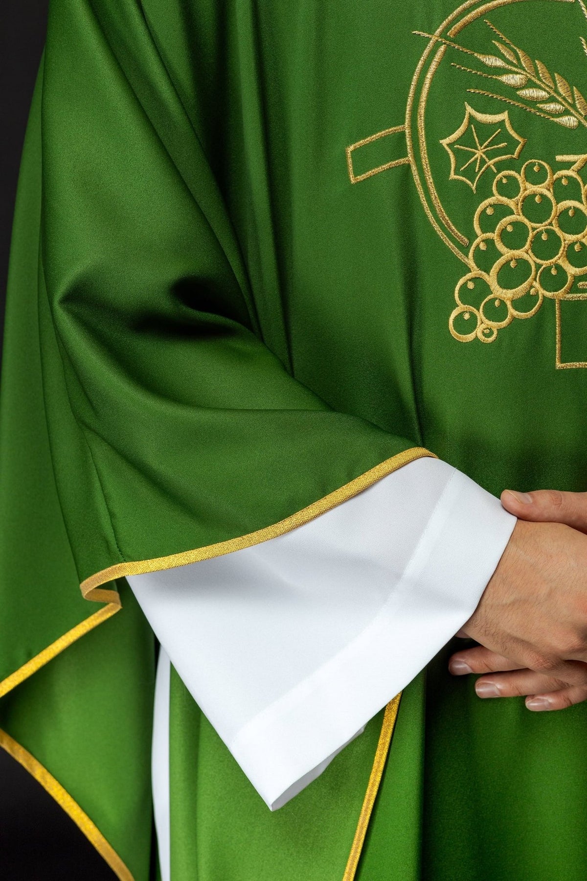 Green chasuble sleeve close-up with gold trim and white cuff