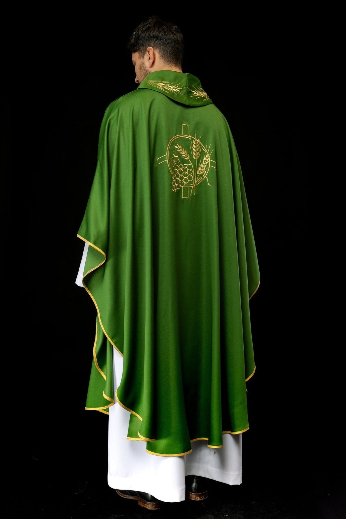 Green chasuble back worn view with gold cross, wheat embroidery and trim