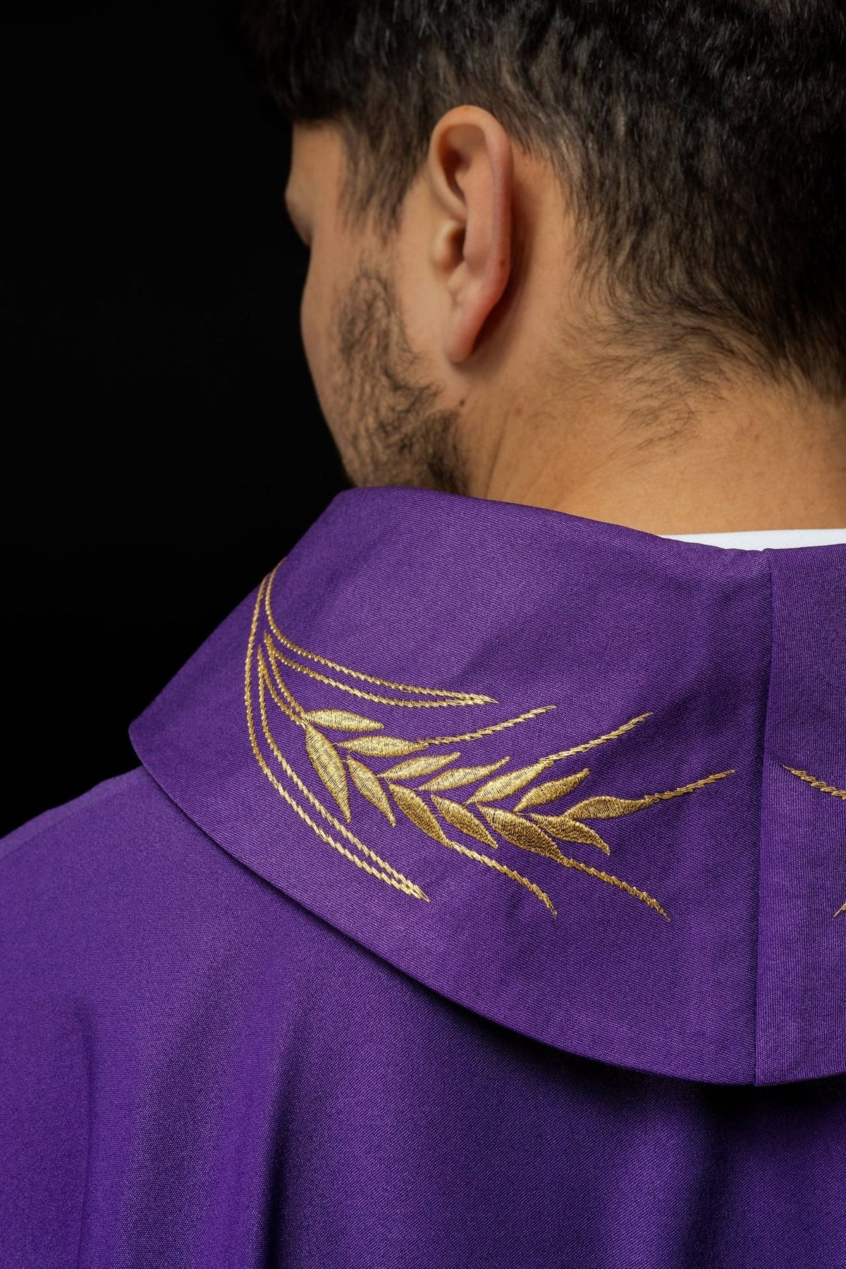 Purple chasuble collar close-up with gold wheat embroidery