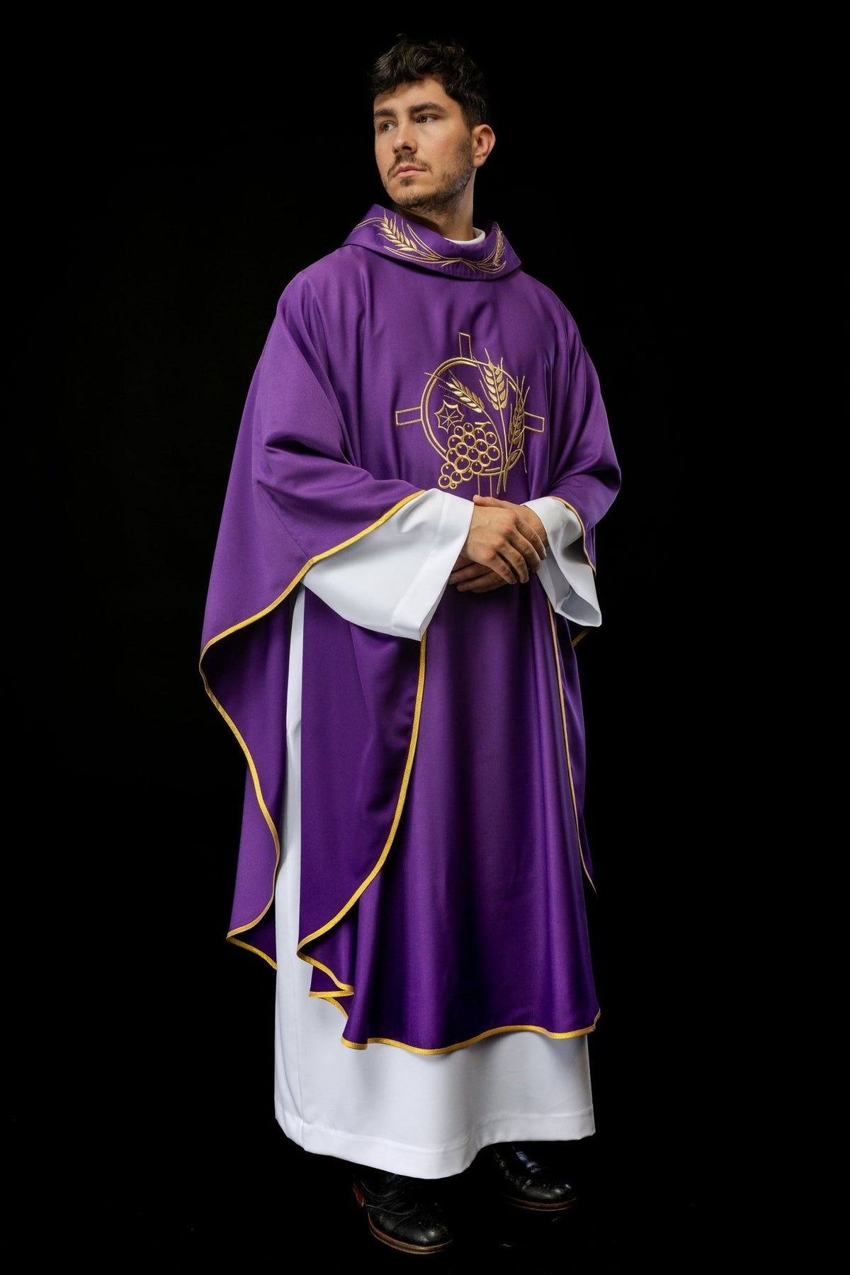 Purple chasuble worn at an angle with gold trim and front embroidery