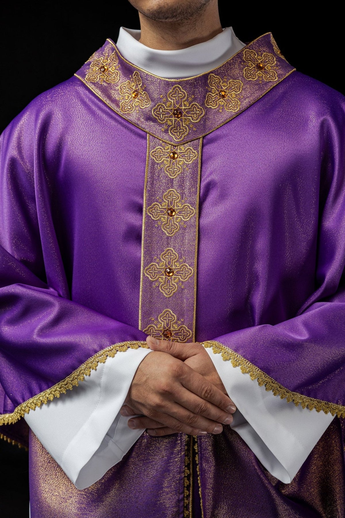 Purple chasuble front close-up with embroidered cross motifs and gold trim