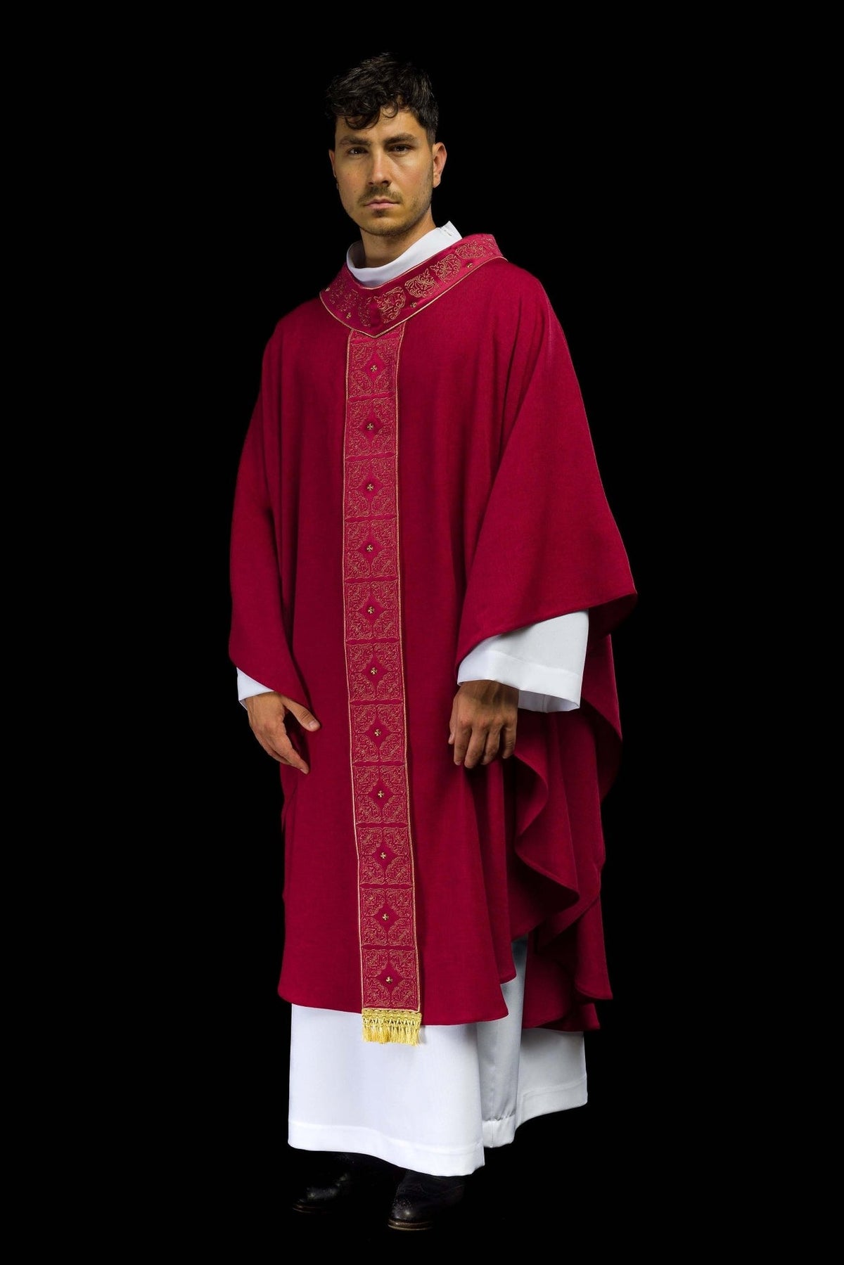 Red chasuble worn in a three-quarter front view with gold embroidered orphrey