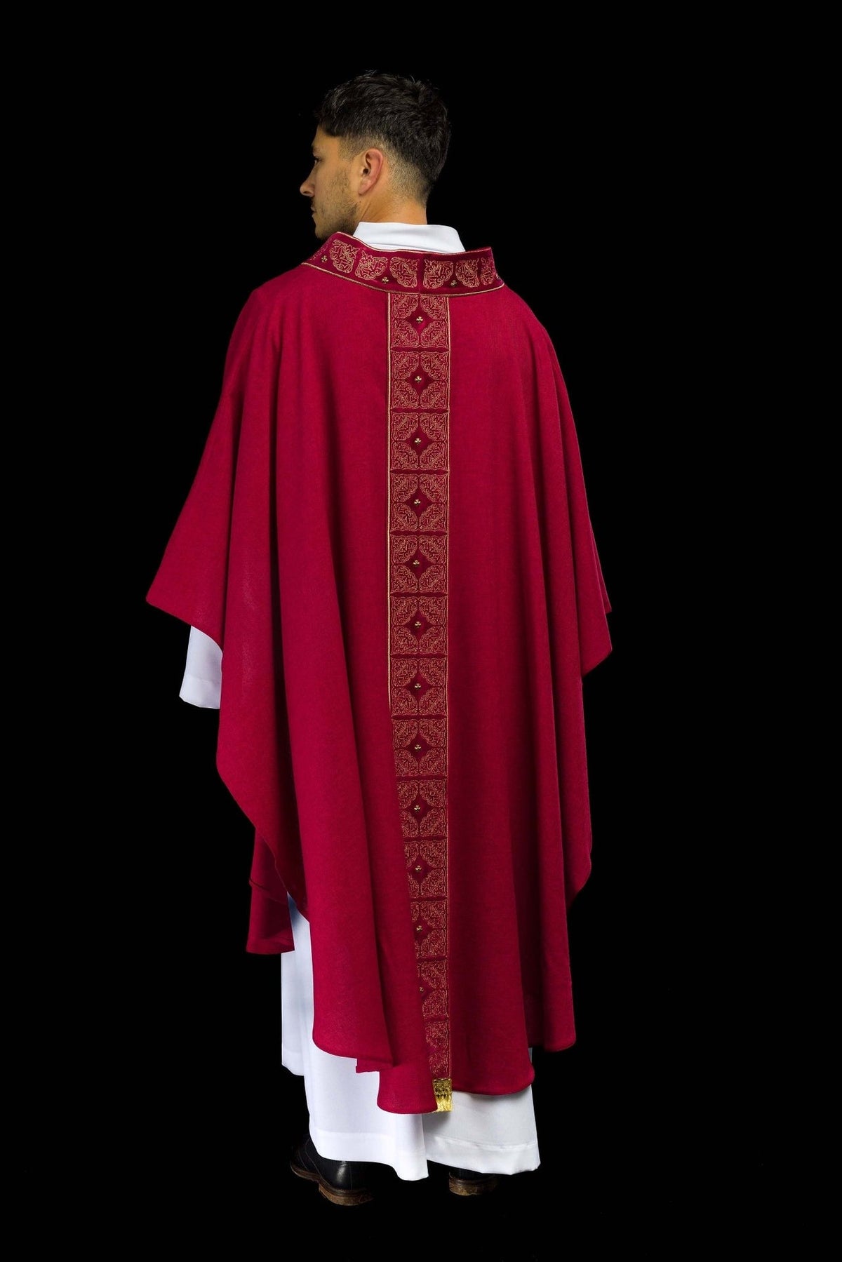 Red chasuble rear three-quarter view with embroidered collar and orphrey