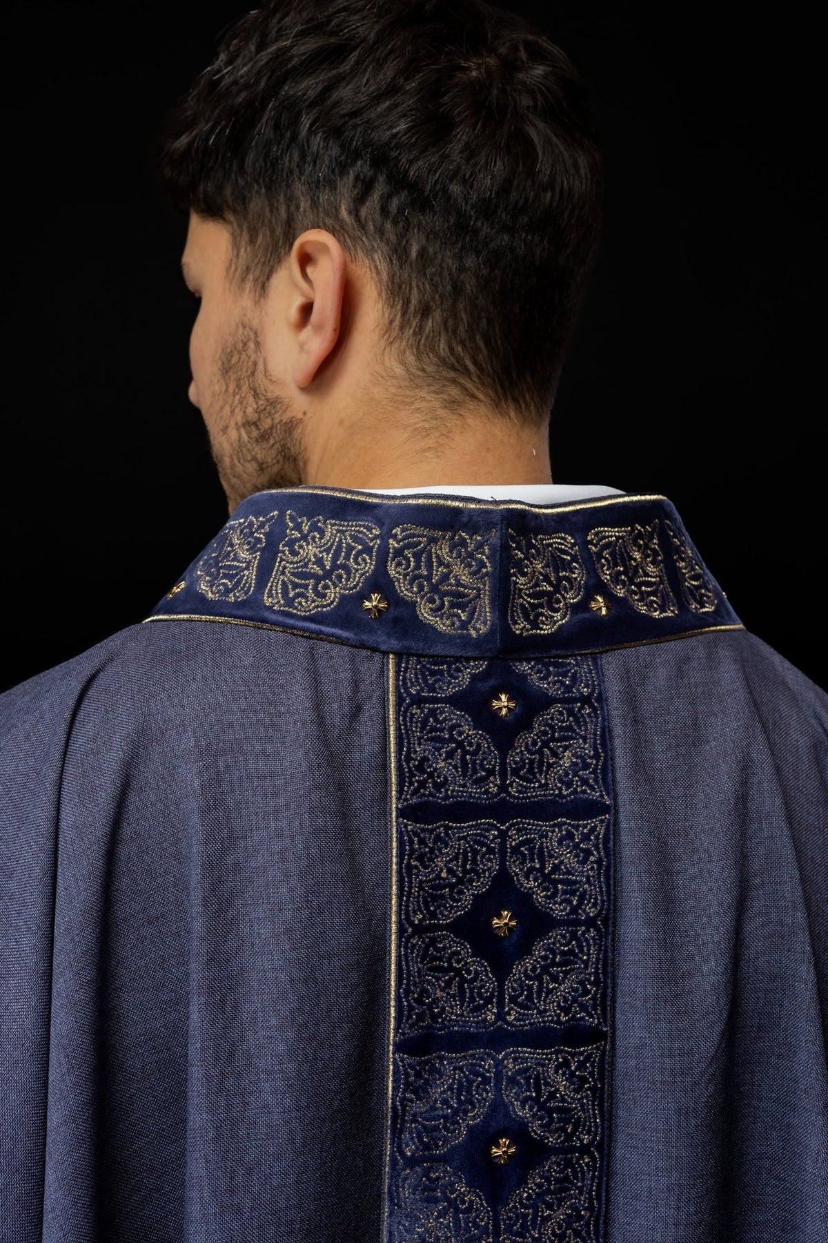 Purple chasuble back close-up with gold embroidered orphrey and collar