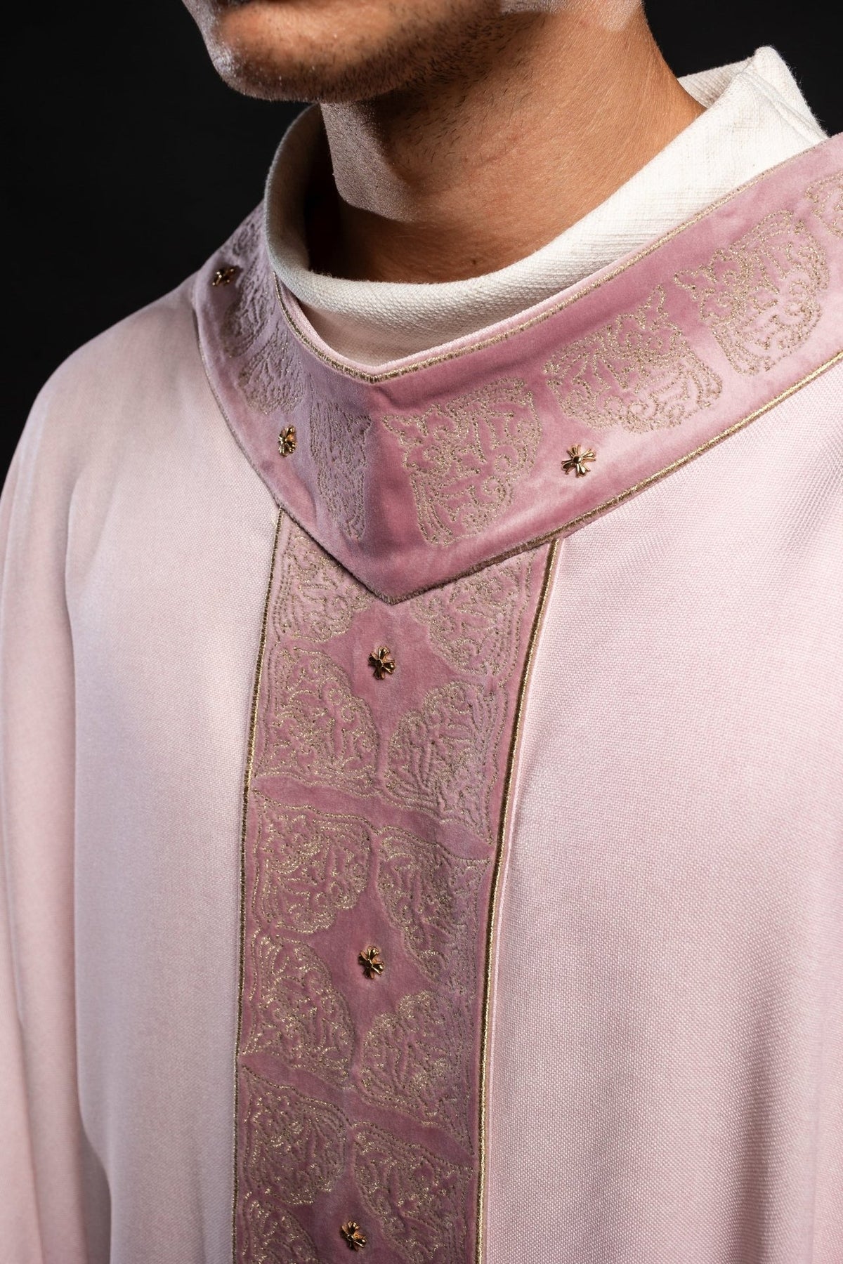 Rose chasuble close-up of embroidered collar and orphrey with gold floral motifs