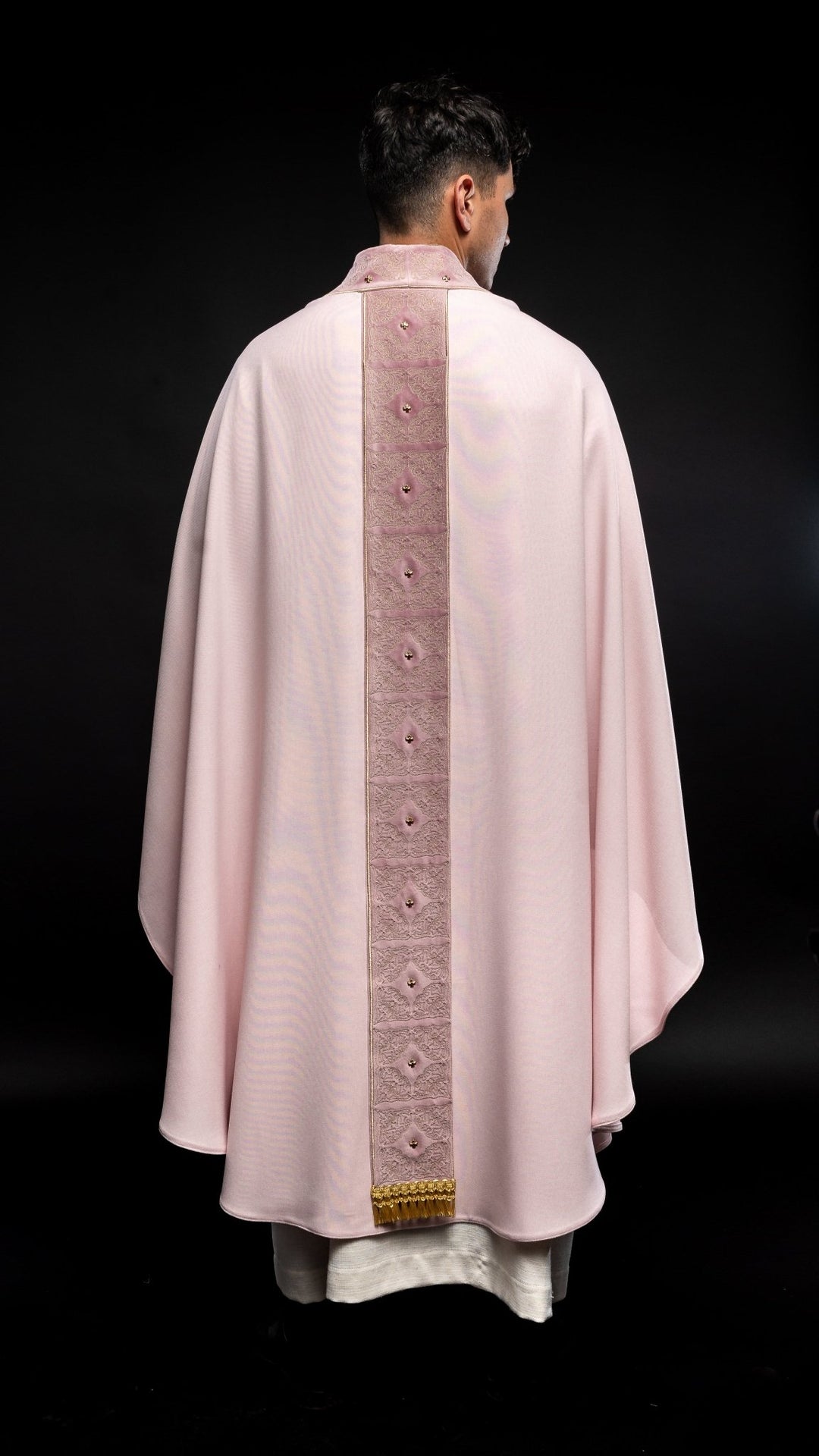 Rose chasuble back view with embroidered orphrey, gold motifs and fringe