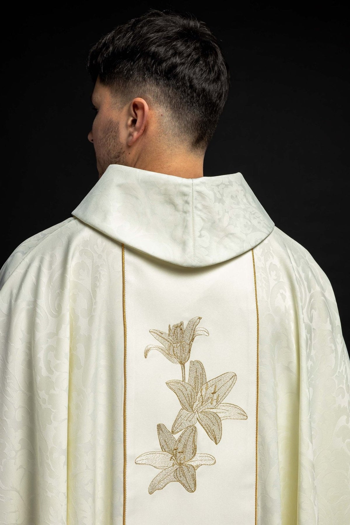 Chasuble back view with ivory stand-up collar and embroidered gold lilies