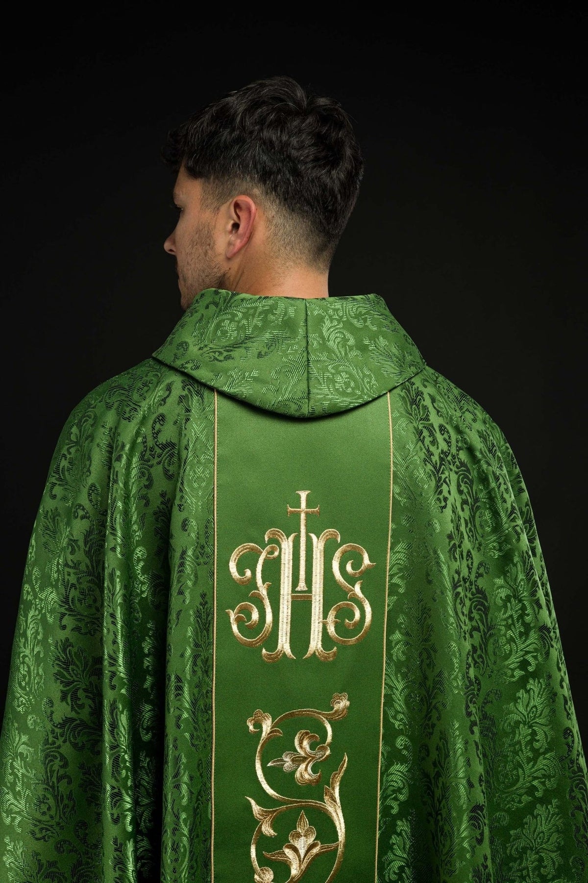 Green chasuble back close-up with patterned stand-up collar and IHS orphrey