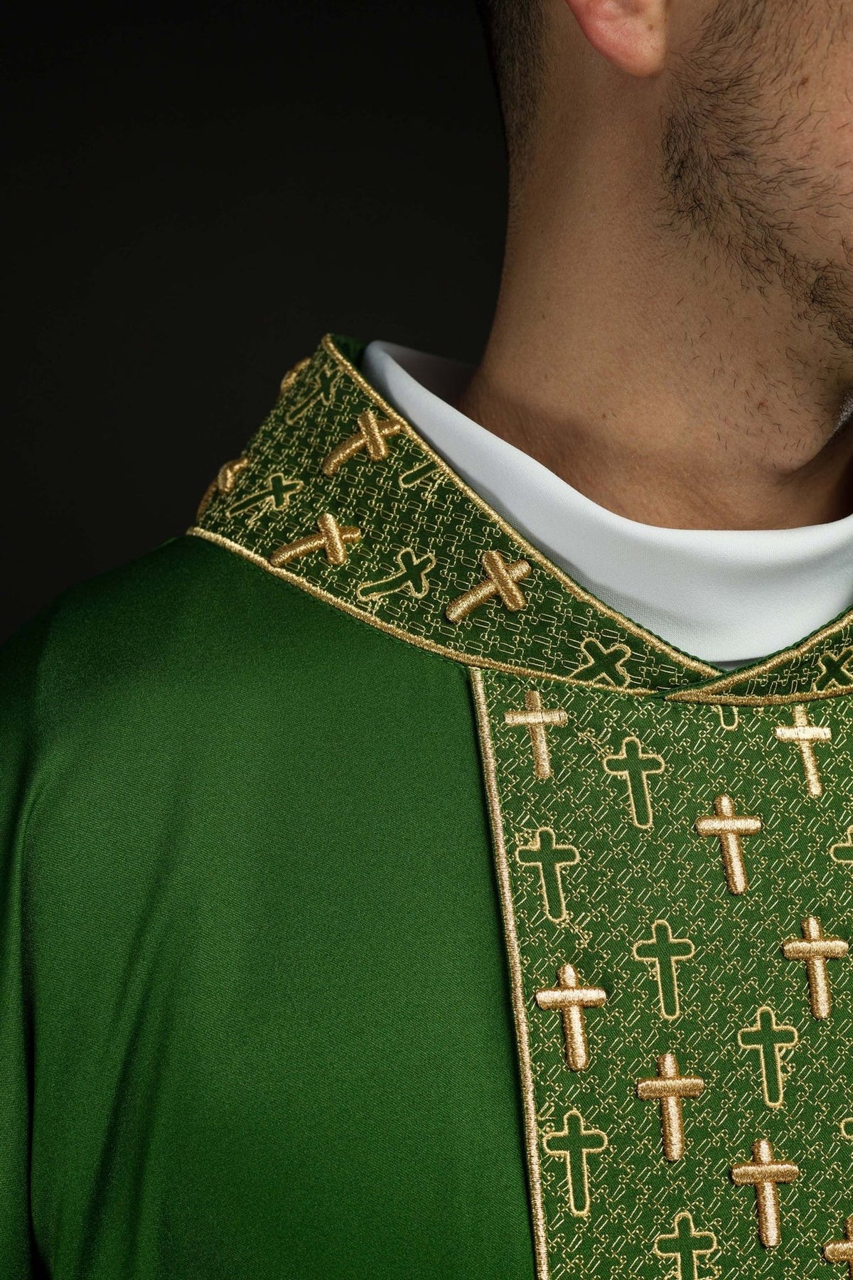 Green chasuble, close-up front view of gold cross embroidery and collar