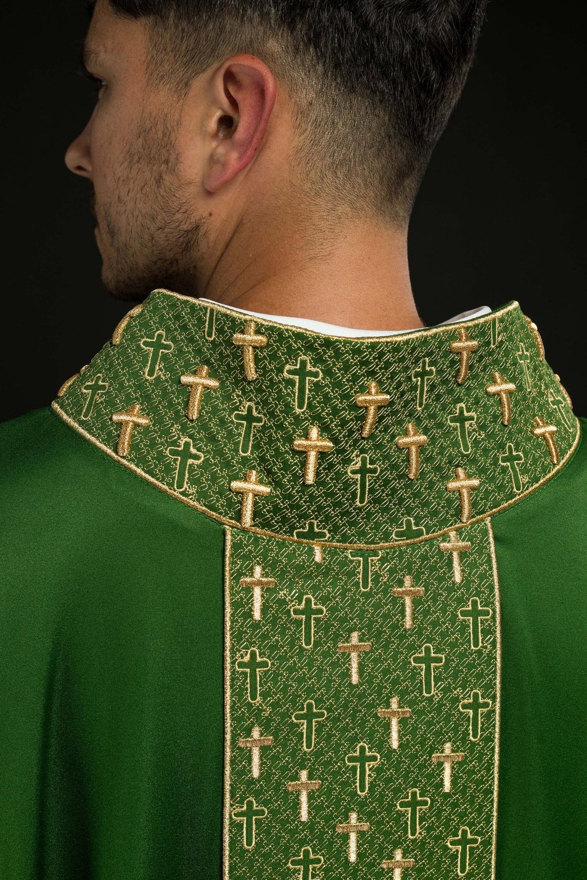 Green chasuble, close-up of embroidered gold cross collar and orphrey