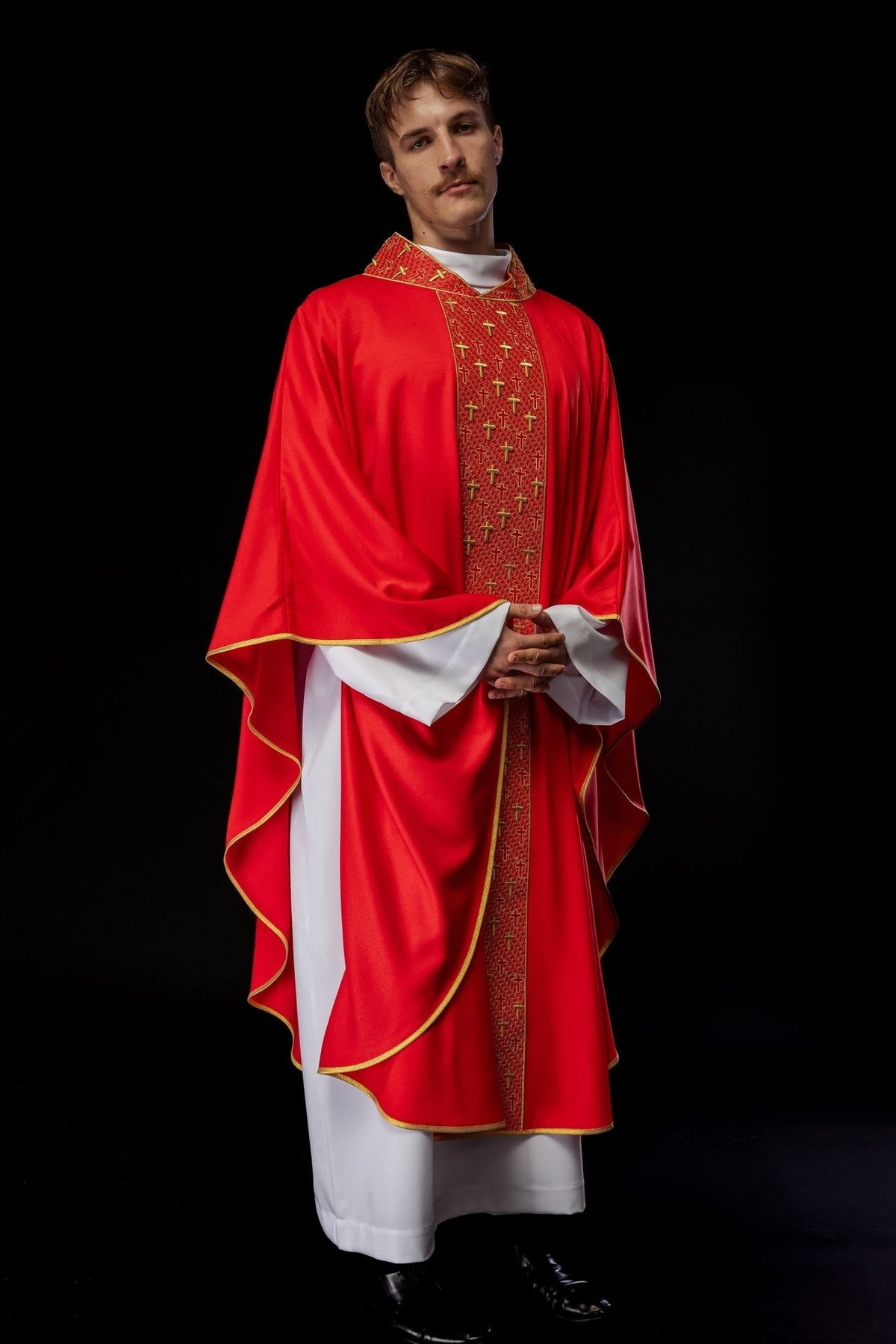 Red chasuble worn front view with embroidered orphrey and gold edging