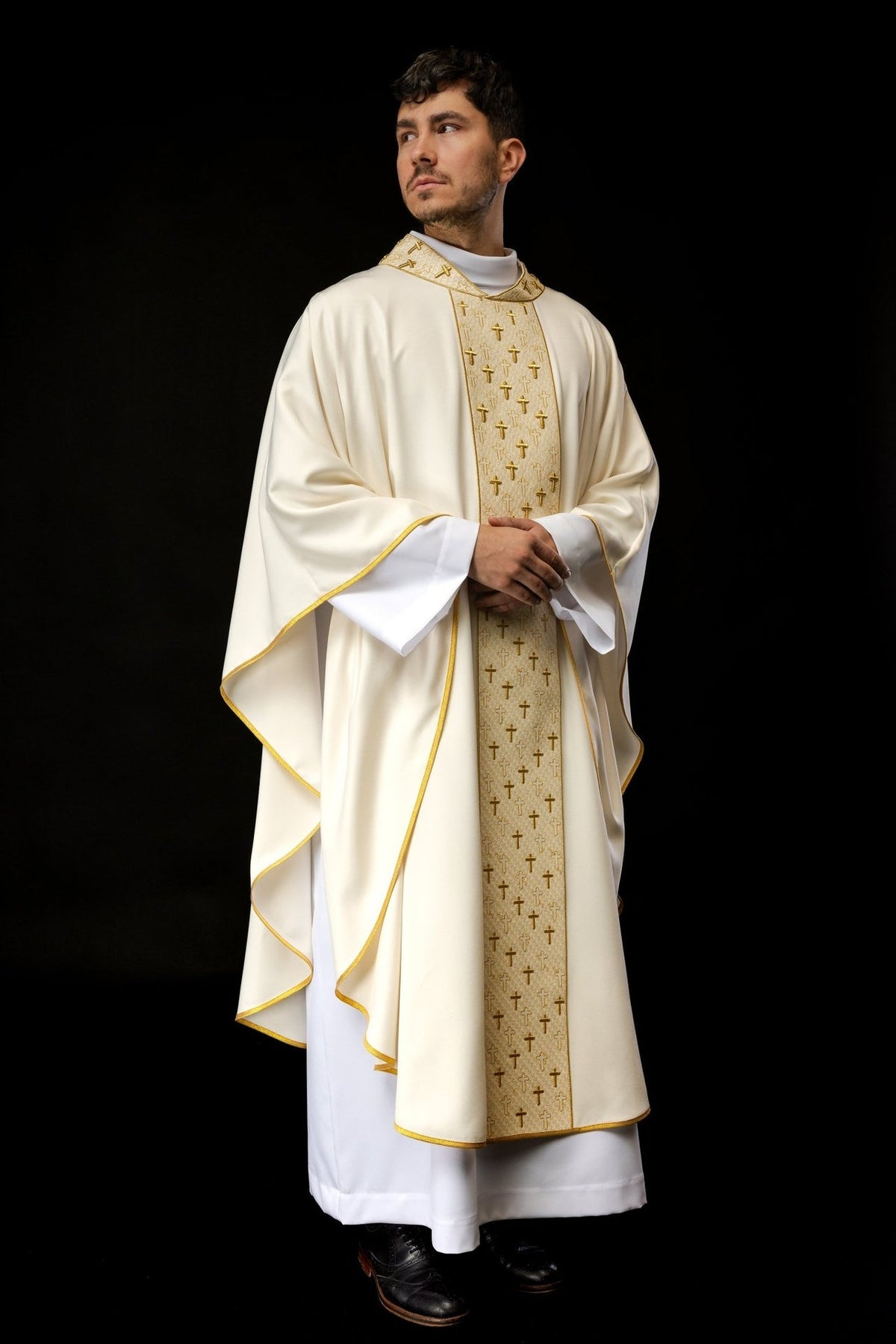 Ecru chasuble, front view with gold-edged sleeves and cross embroidery