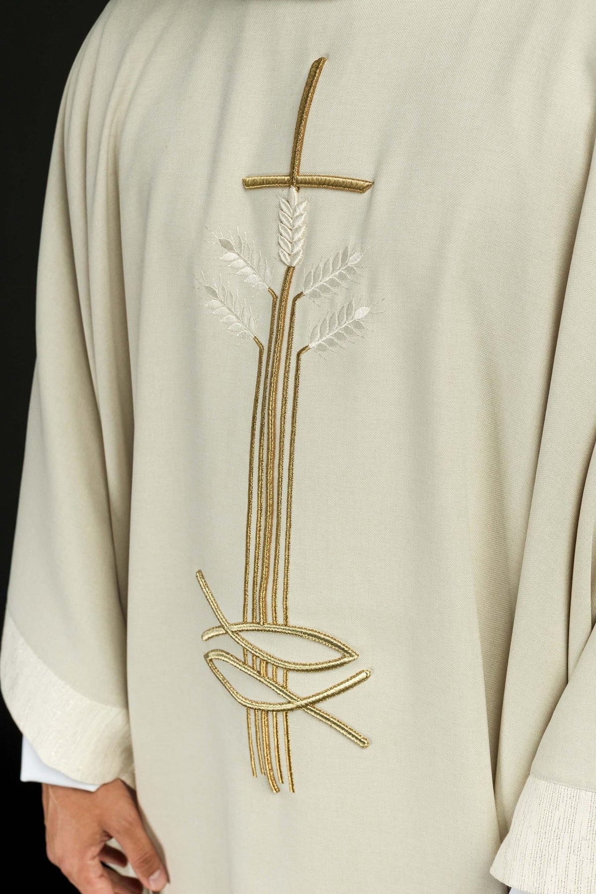 Ecru chasuble close-up of gold cross, wheat and fish embroidery