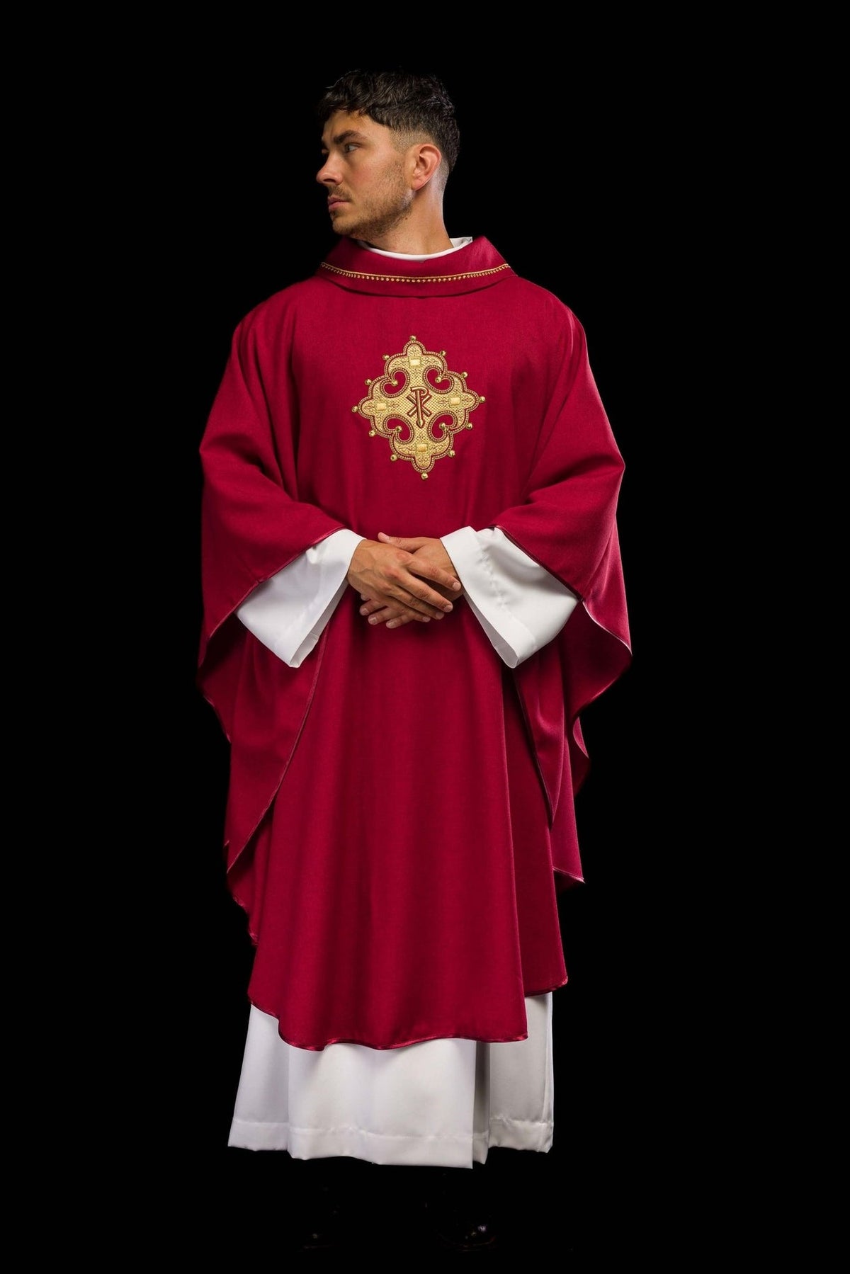 Red chasuble back view with embroidered gold cross and collar trim