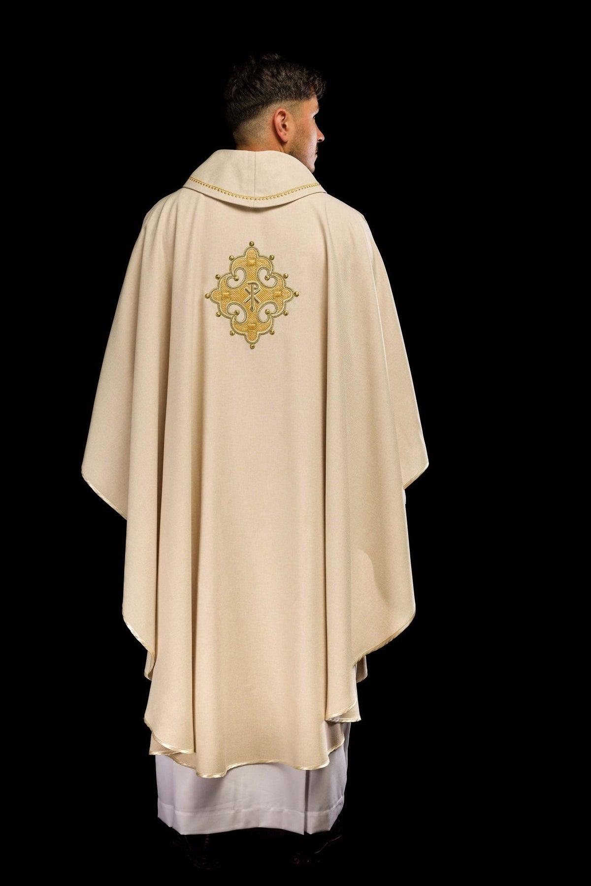 Ecru chasuble worn, back view with embroidered cross