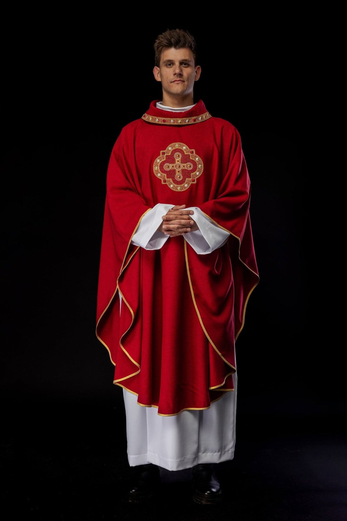 Red chasuble, full front view worn with gold cross embroidery
