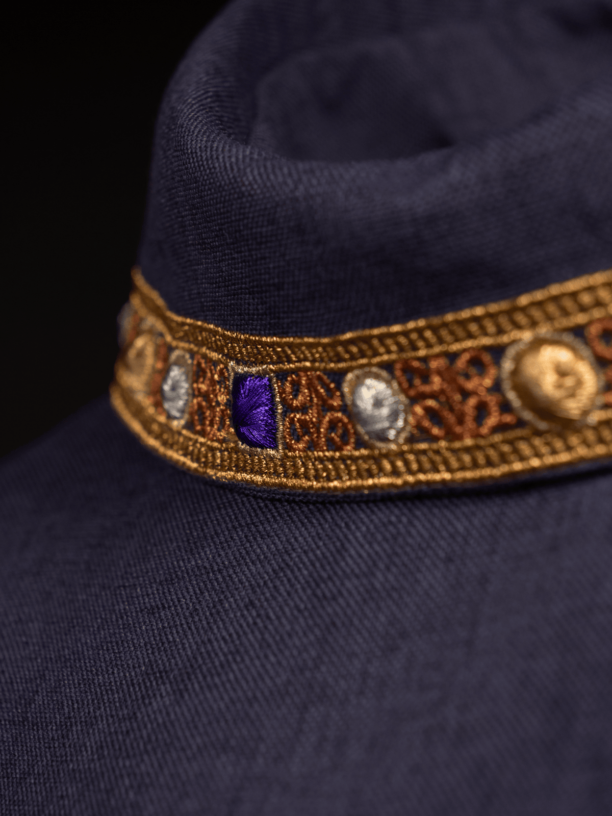Purple chasuble close-up of embroidered gold collar trim