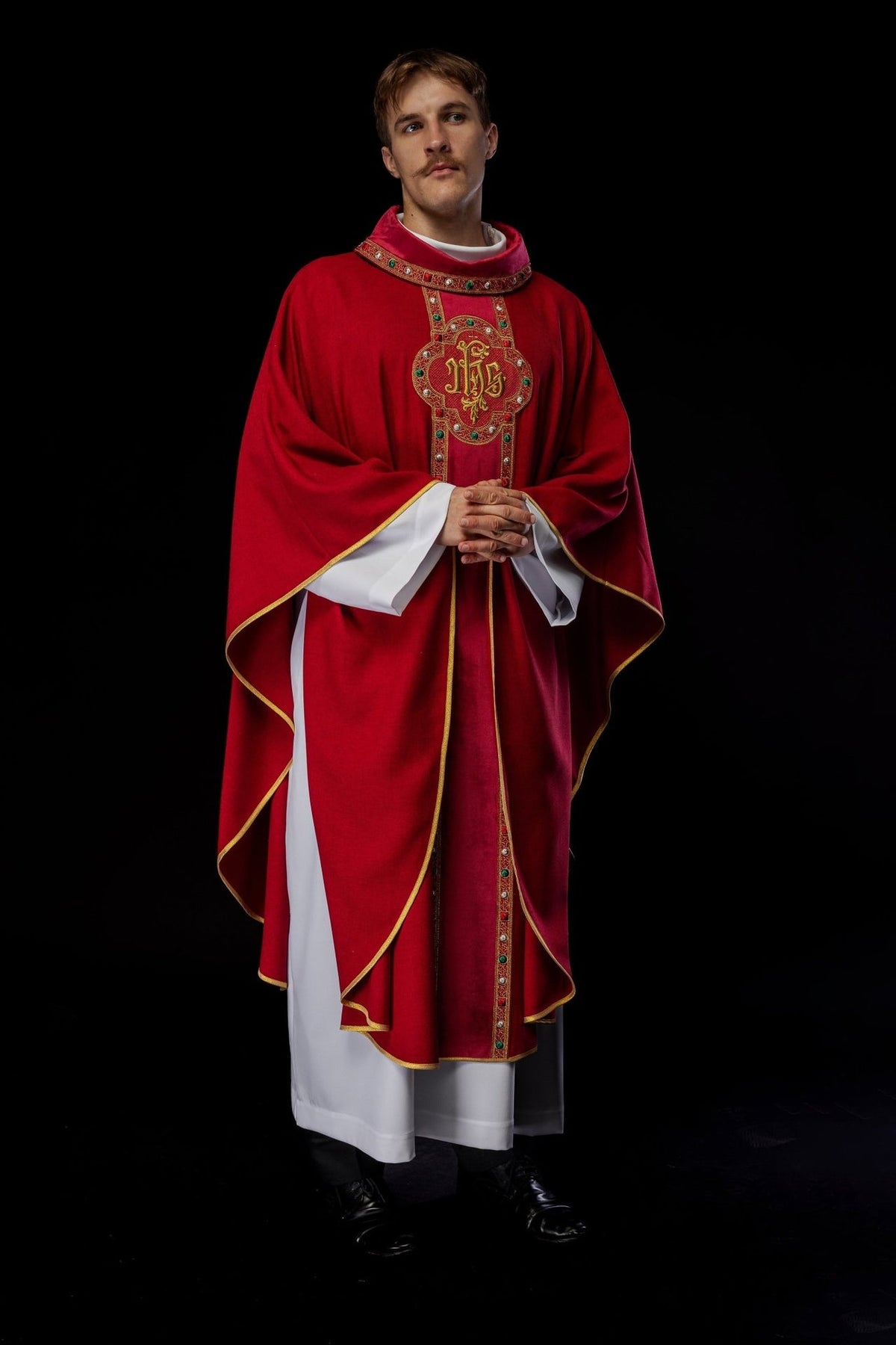 Red chasuble front worn view with embroidered IHS orphrey
