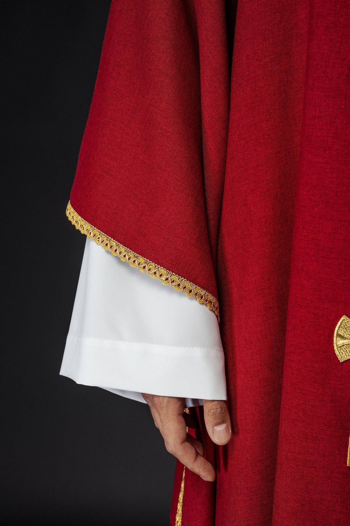 Red chasuble sleeve and gold trim detail