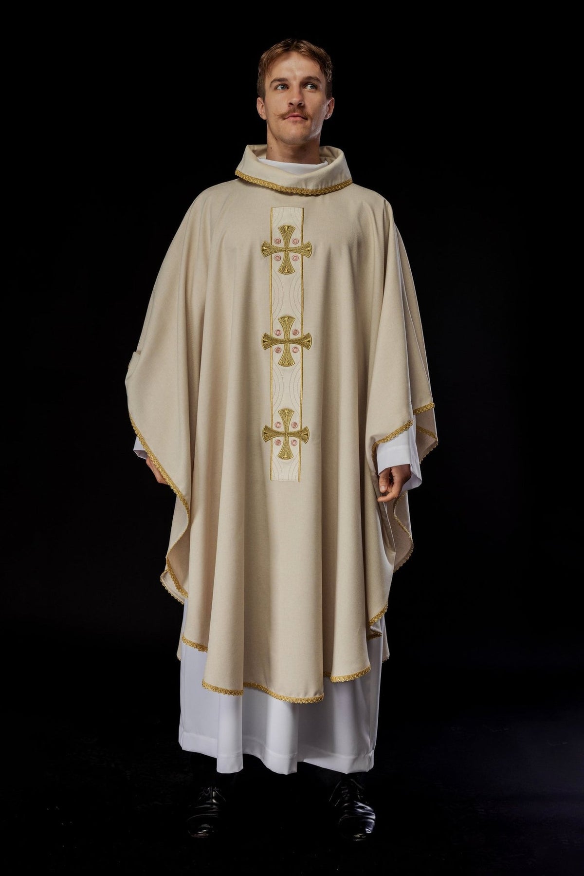 Ecru chasuble worn in a full front view with embroidered gold crosses