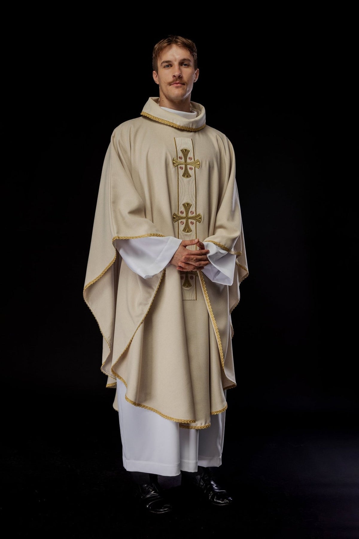 Ecru chasuble worn in a three-quarter front view with gold trim