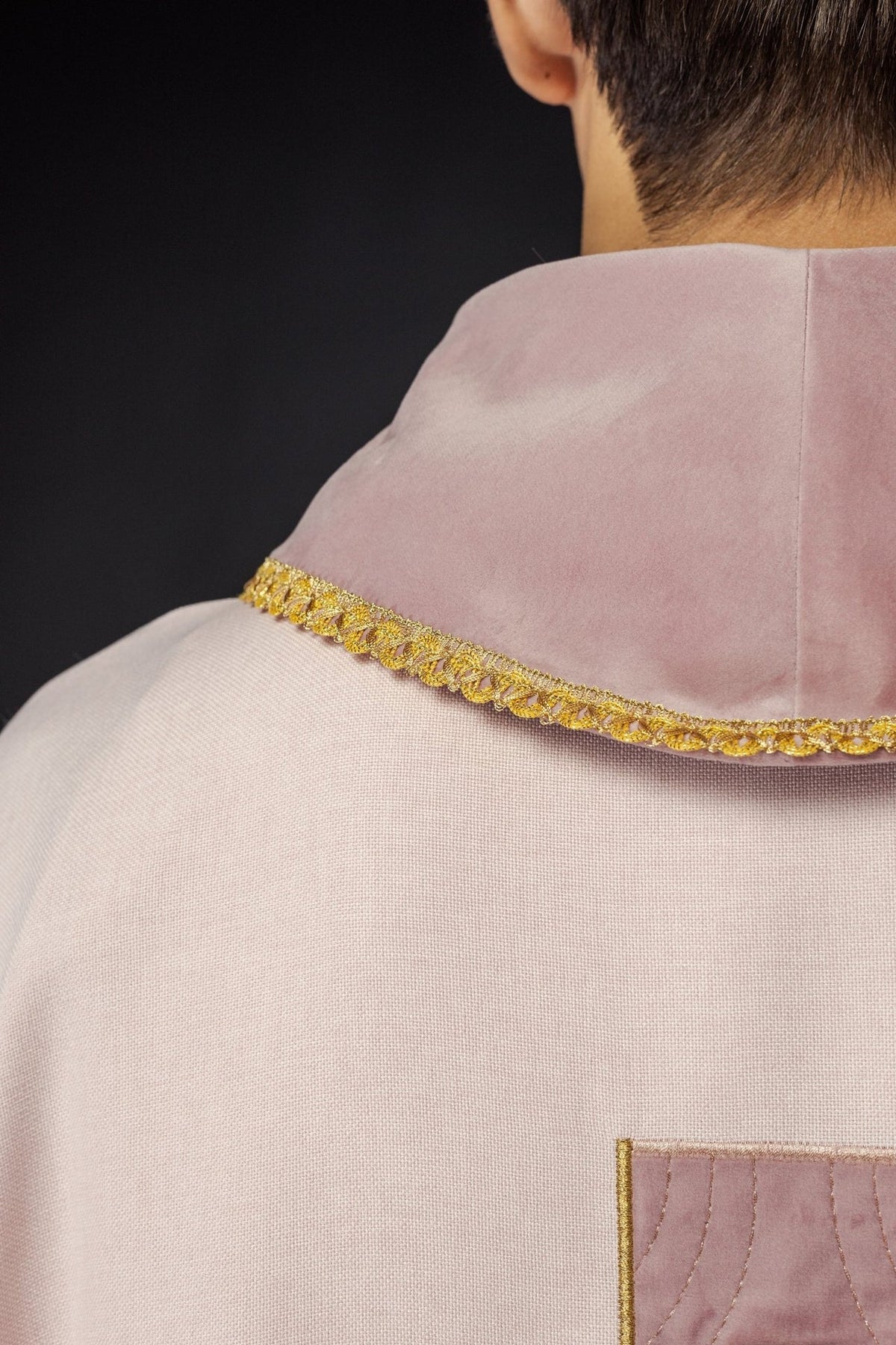 Rose chasuble back close-up with gold collar trim