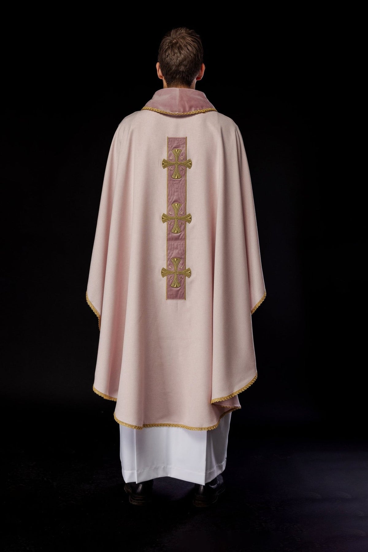 Rose chasuble side view with gold trim and embroidered crosses