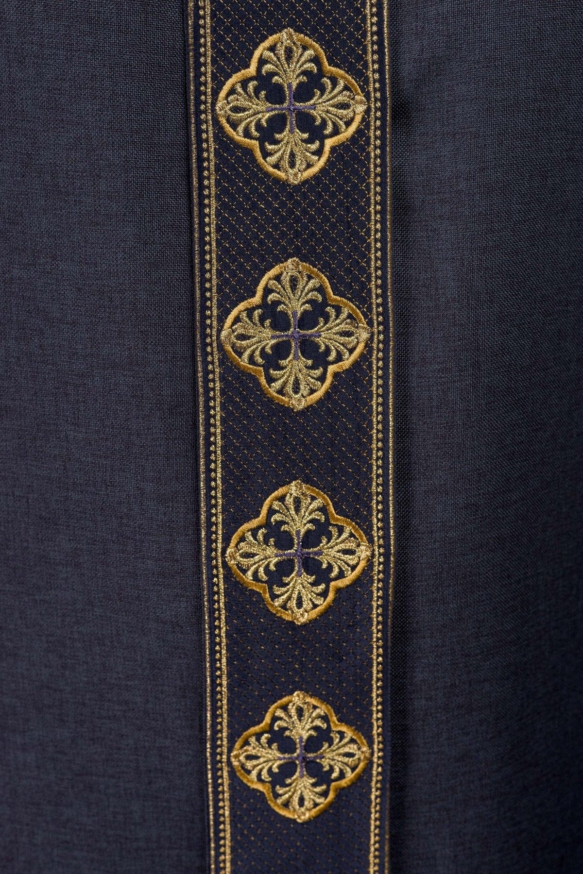 Purple chasuble close-up of gold embroidery on the front orphrey