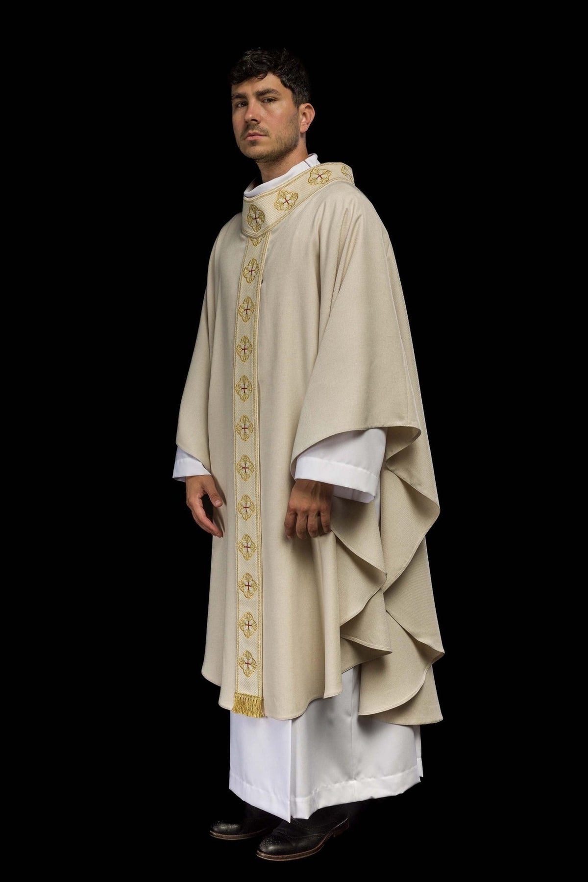 Ecru chasuble side view showing draped shape and embroidered orphrey