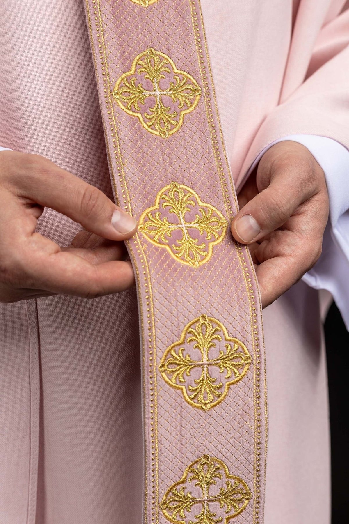 Rose chasuble close-up of embroidered gold orphrey with repeated cross motifs