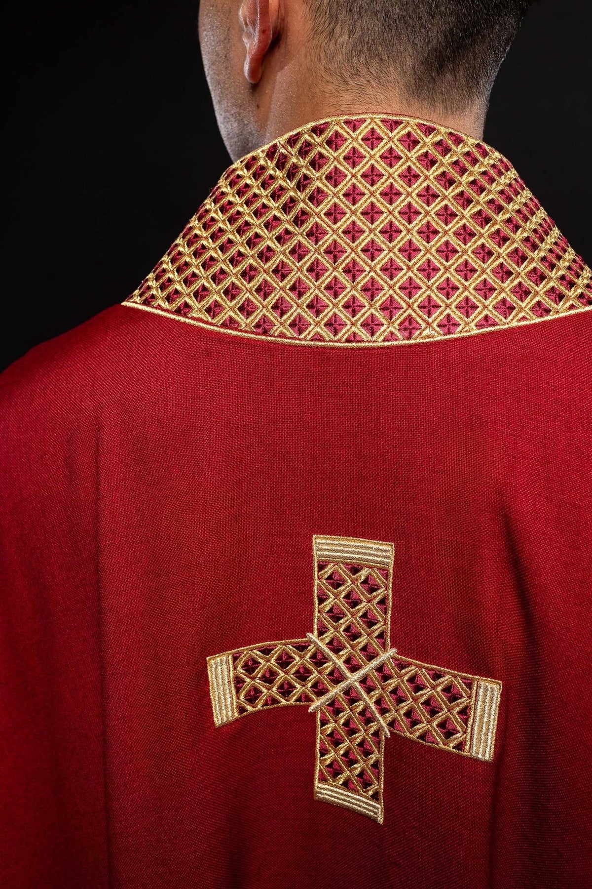 Red chasuble, back close-up with gold embroidered cross and patterned collar