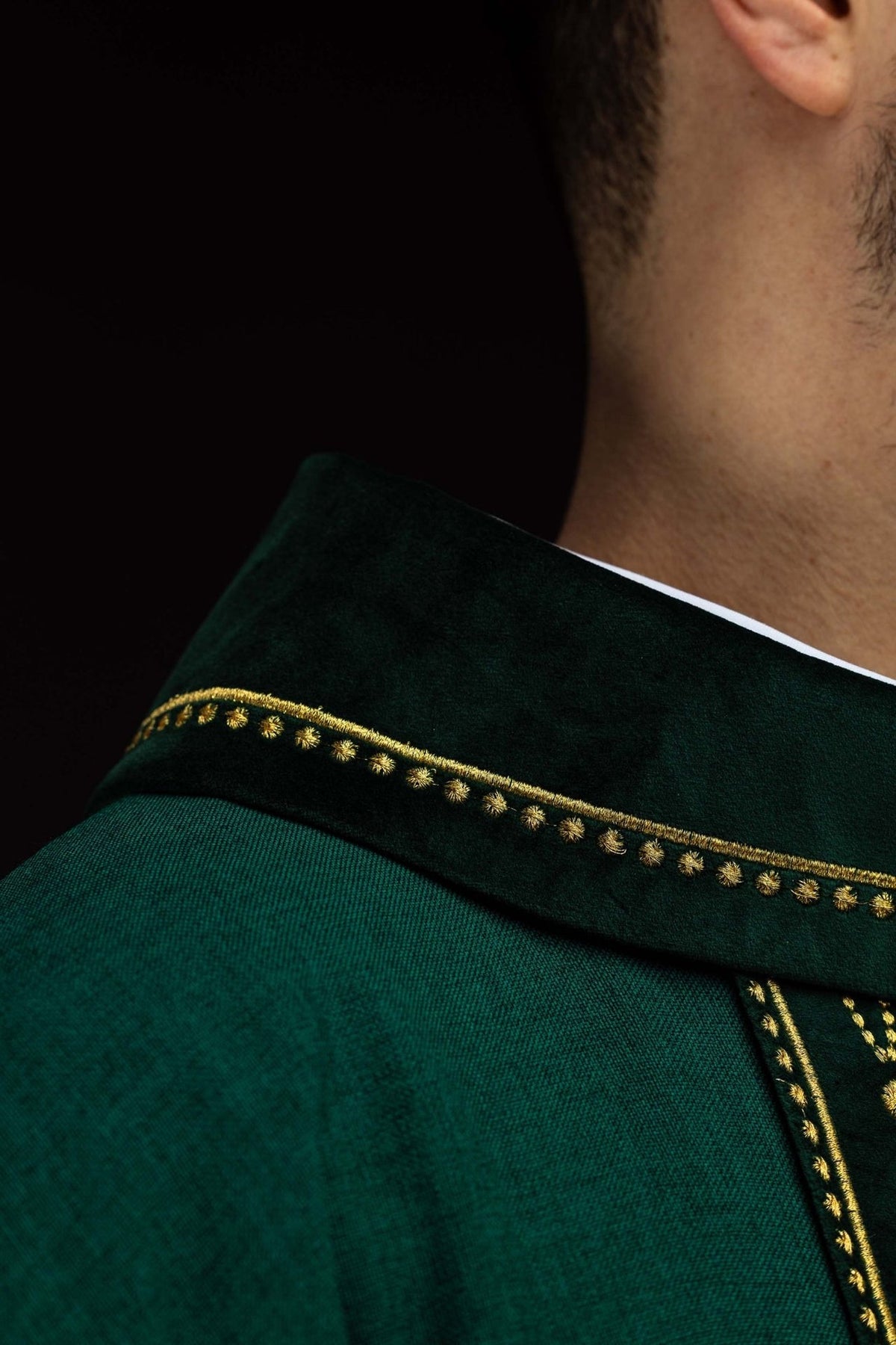 Green chasuble collar close-up with gold embroidered trim