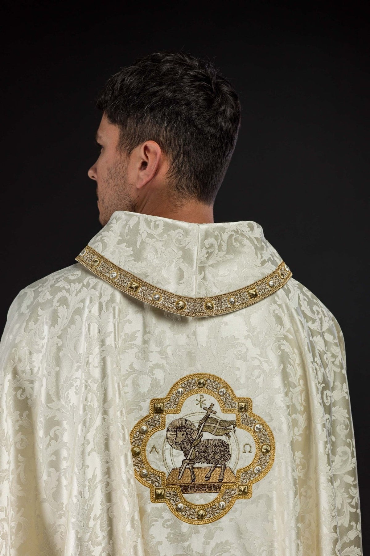 Ecru chasuble back view with Paschal Lamb embroidery and gold-trimmed collar