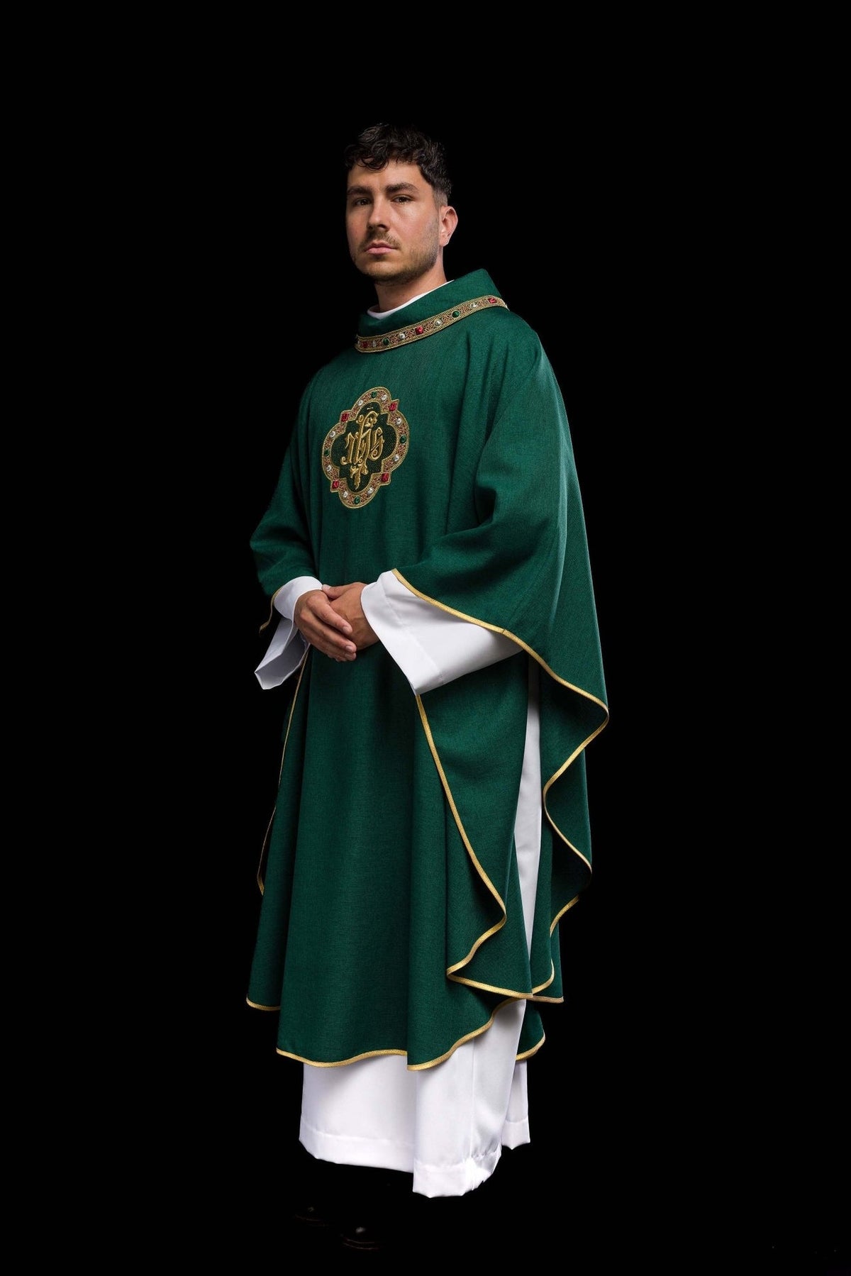 Green chasuble worn in three-quarter front view with IHS embroidery and gold trim