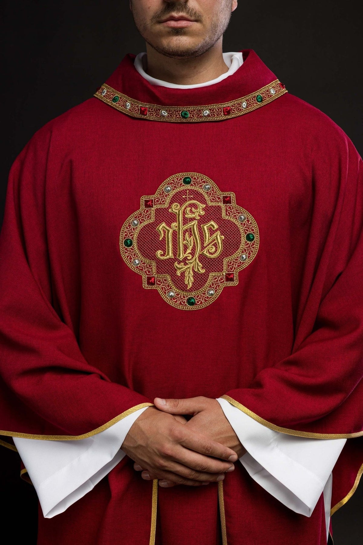 Red chasuble, front close-up of ornate IHS embroidery and decorative collar trim