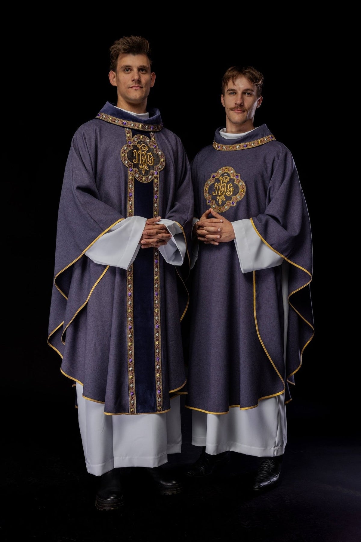 Purple chasuble worn front view with IHS embroidery and trimmed collar