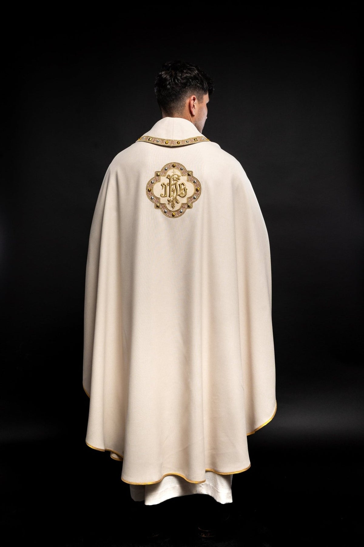 Ecru chasuble back view with IHS embroidery and gold trim